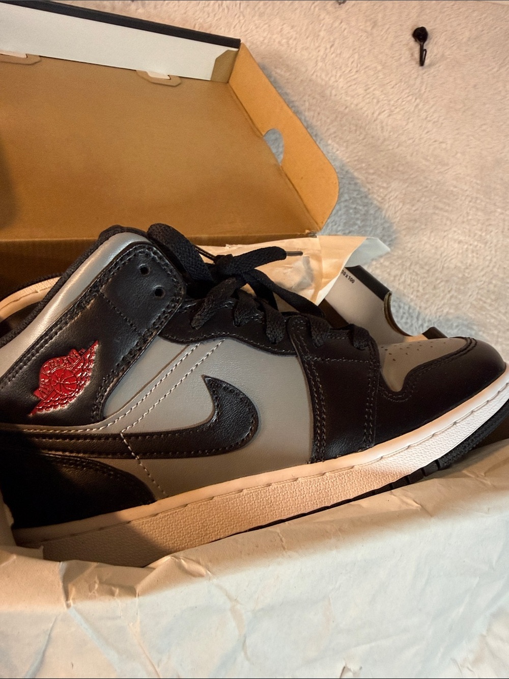 Nike Kids Black and Gray High-Top Sneakers with Red Wing Logo